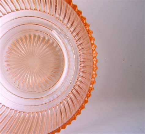 Depression glass, which was made during the great depression, usually came in bright colors, like yellow, amber, blue, green, or pink. . Depression glass pattern identification